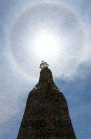 The sun above a statue of Our Lady of Fatima, May 13, 2011
