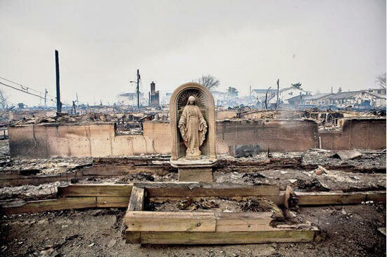 An intact statue of Our Lady surrounded by the ruins of Katrina