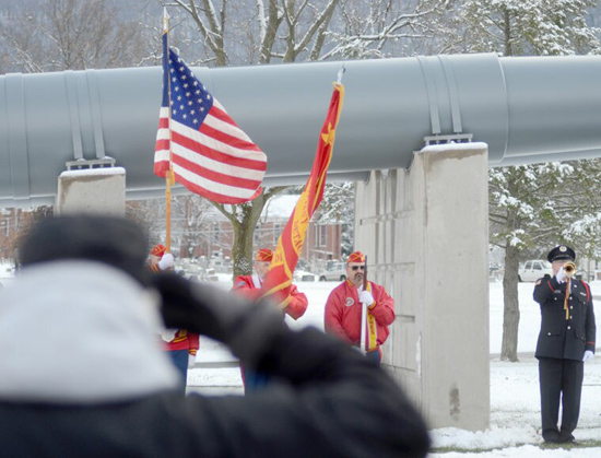  men saluting, holding flags, and playing taps at the Pearl Harbor remembrance day Tribute, Pennsylvania Military Museum on Boalsburg