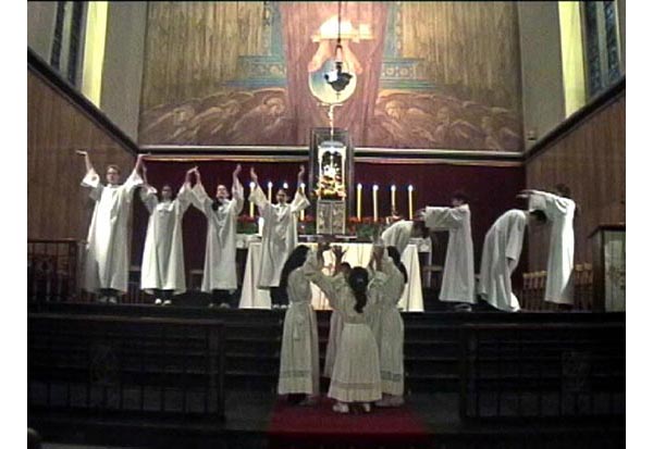 Members of the choir dancing around an altar