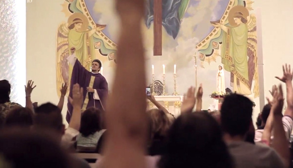 The Elvis Presley Priest in front of his crowd