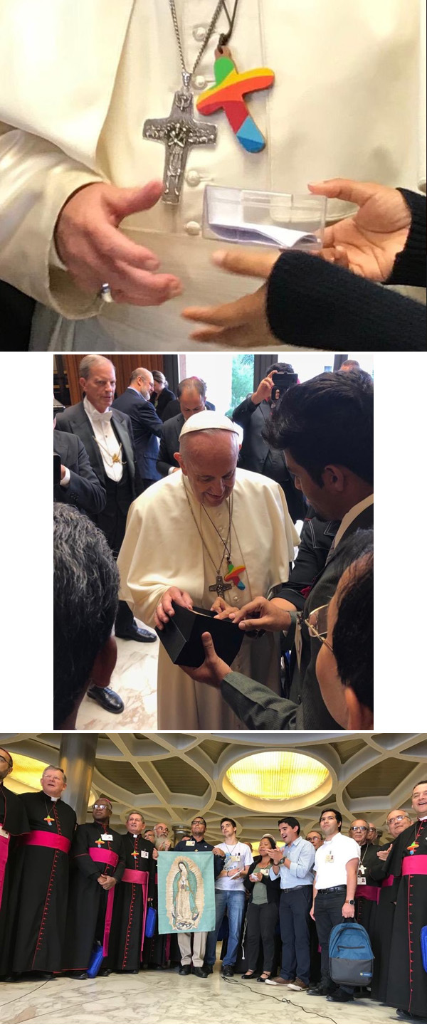 Pope FRancis wears a rainbow cross 2