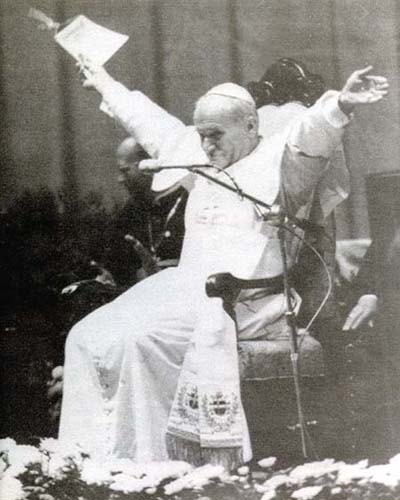 John Paul II waving his hands in the air