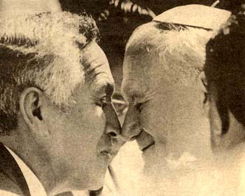 John Paul II rubbing noses with a New Zealand official