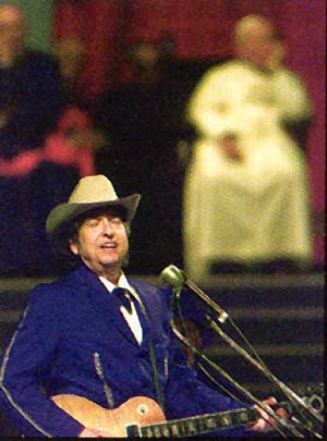 Rock star Bob Dylan performs in front of John Paul II