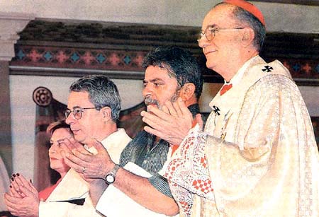 A photograph of Cardinal Hummes, president Lula, and Frei Betto