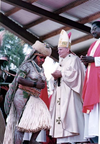A bare-breasted native woman leaving the Popes presence in Papua New Guinea