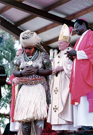 A bare-breasted Papua new Guinea native woman leaving the Pope