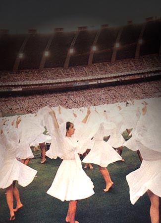 Bare legged young women in white dresses dancing in for Pope John Paul II