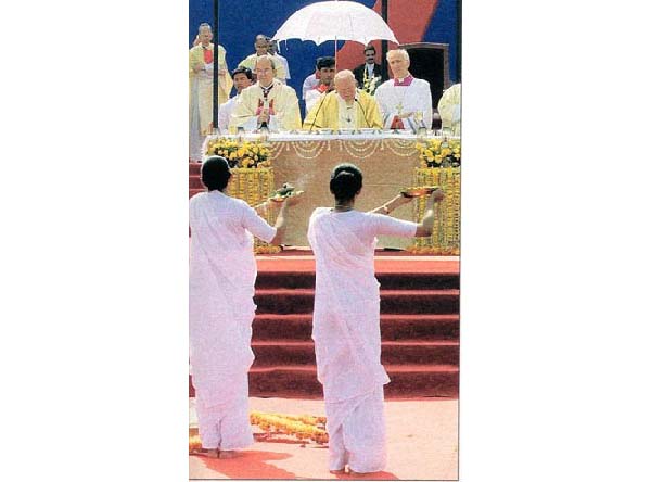 Young women from India dance during mass for Pope John Paul II