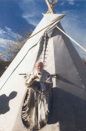 Pope John Paul II wears Indian vestments and emerges from a teepee