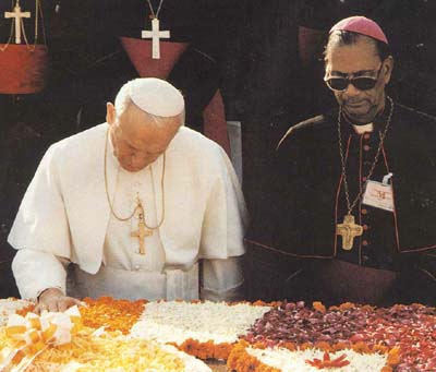 John Paul II paying homag to the tomb of Gandhi