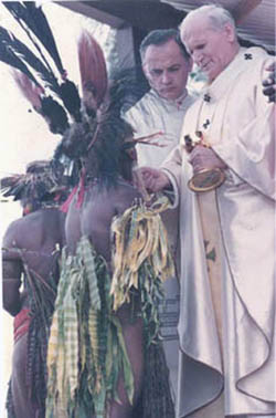 John Paul II giving communion to semi-naked natives