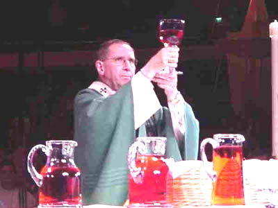 Cardinal Mahoney consecrating wine in lemonade pitchers