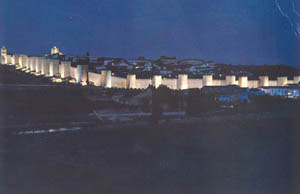 A night photograph of the modern walled city of Avila