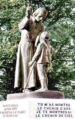 A statue of the Cure of Ars thanking the boy who guided him