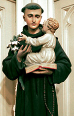 A statue of St Anthony with a soft and sentimental expression
