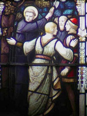 Stained glass window depicting St. Boniface cutting down the pagan oak