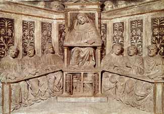 A carving of a lecture at the University of Bologna
