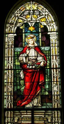 A stained glass window of St. Elizabeth of Portugal