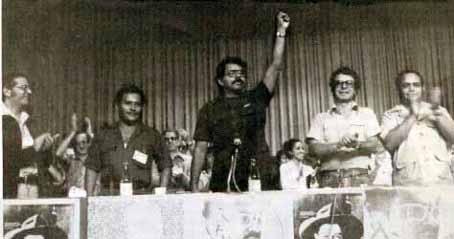 Ortega raises his fist in a gesture of triumph