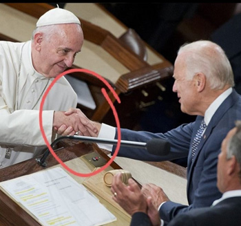 Masonic handshake to Joe Biden