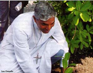 Archbishop Cornelio planting trees