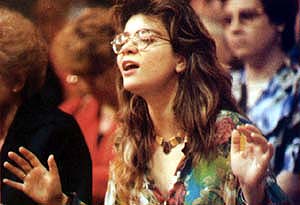 A woman overcome by emotions during a charismatic ceremony