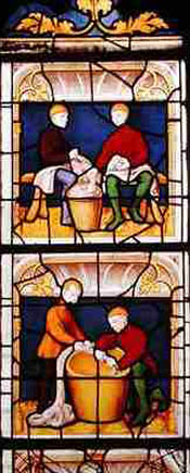 Stained glass windows portraying clothes merchants