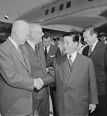 Photograph showing Diem welcomed by President Eisenhower and Secretary of State Dulles