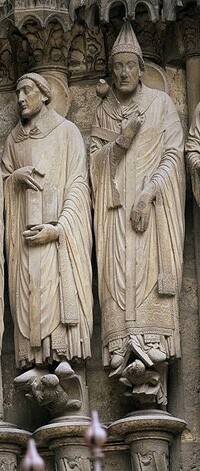 carved stone statues of St. Jerome and St. Gregory on the facade of Chartres Cathedral