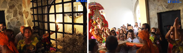 A Hindu woman touching the glass barrier by the crucifix and blessing the Ganesh statue