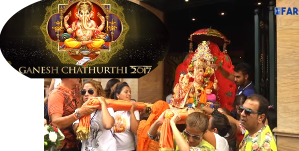 people carrying a statue of ganesh out of the hindu temple of ceuta