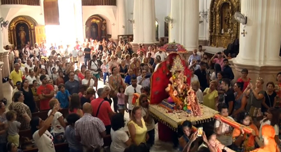 Crowds carrying the Ganesh statue out of the sanctuary of Ceuta