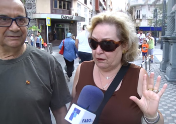 An elderly couple being interviewed defend the Ganesh statue entering the sanctuary