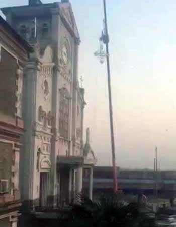 A cross being ripped off a building in China