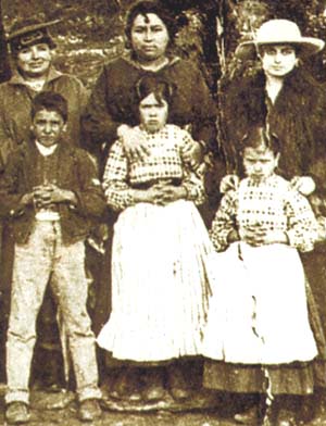 A photograph of the three seers of Fatima and their parents