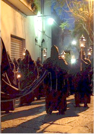 A penitential procession behind the Dead Christ