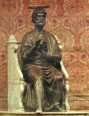 A statue of St. Peter sitting on his throne
